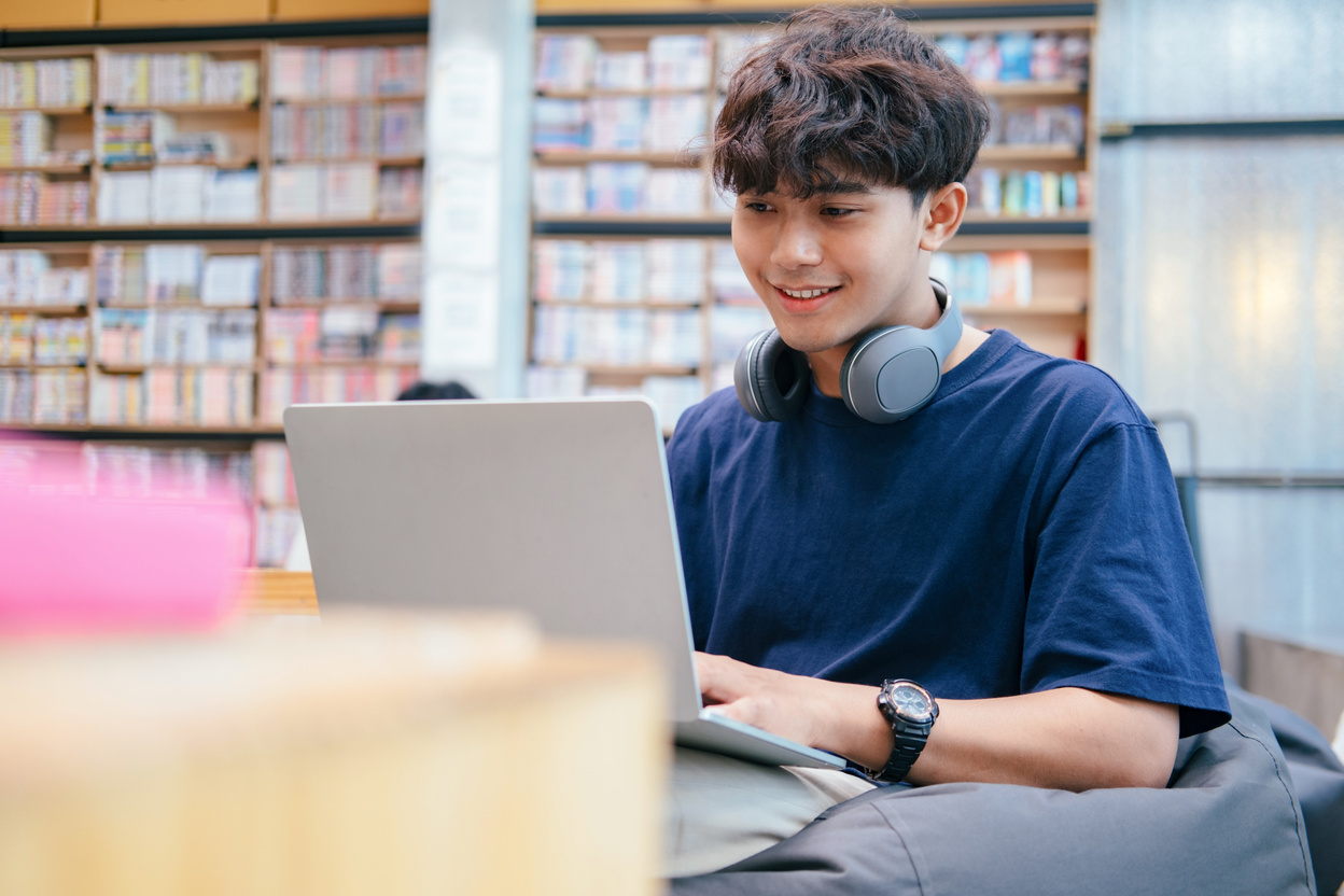 Student on Library Researching Online 