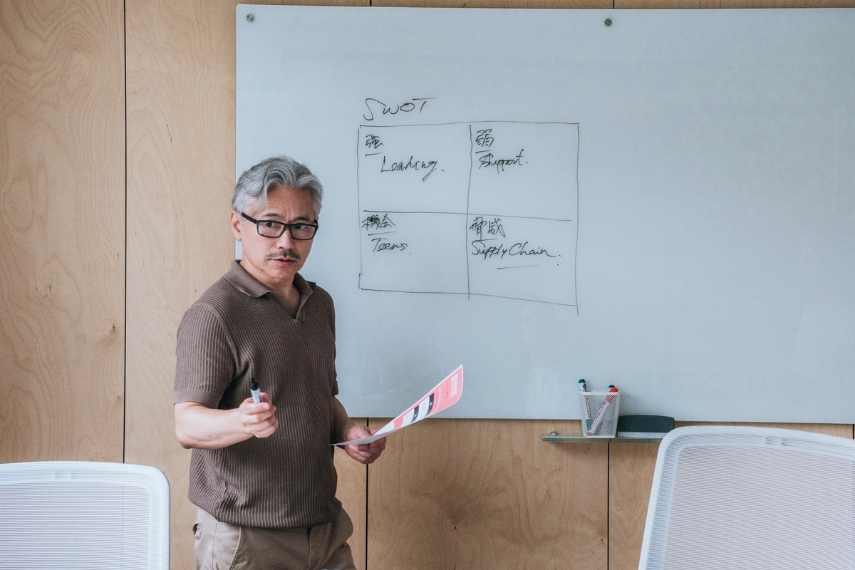 Man Sharing an Idea on a Whiteboard